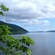 A vast body of water known as Loch Ness beneath partly cloudy skies